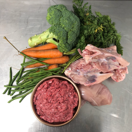 The Butchers Dog Southport - Chicken & Vegetable raw dog food on metal table